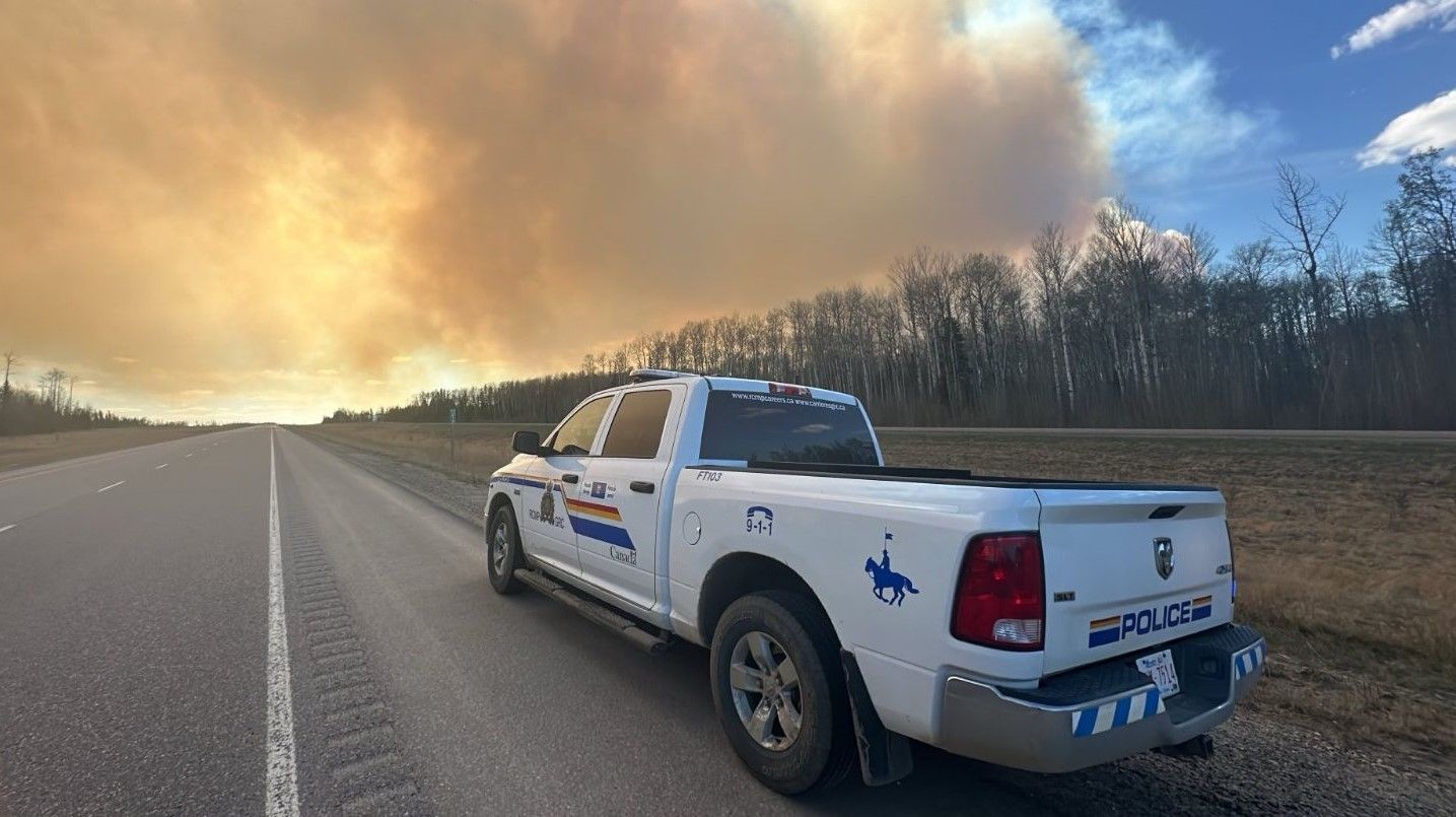 Fort McMurray schools open Monday, wildfire evacuation warning active