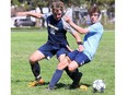 Chatham-Kent Golden Hawks' Phillip Wende, left, and Ursuline Lancers' Aiden VenHuizen battle for the ball in an LKSSAA senior boys soccer game at Ursuline College Chatham in Chatham, Ont., on Tuesday, April 30, 2024. Mark Malone/Chatham Daily News/Postmedia Network