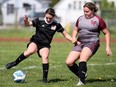 Northern Vikings' Tori Johnston, left, fends off Wallaceburg Tartans' Julie Vandendool in an LKSSAA senior girls soccer game at Wallaceburg District Secondary School in Wallaceburg, Ont., on Thursday, May 2, 2024. Mark Malone/Chatham Daily News/Postmedia Network