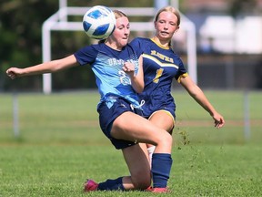 Chatham-Kent Golden Hawks' Hayden Heinhuis (1) kicks the ball away from Ursuline Lancers' Adyson Teeuwen (22) in an LKSSAA senior girls soccer AAA semifinal at the Chatham-Kent Community Athletic Complex in Chatham, Ont., on Tuesday, May 21, 2024. (Mark Malone/Chatham Daily News)