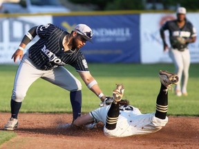 London Majors shortstop Tommy Reyes-Cruz (21) tags out Chatham-Kent Barnstormers' Braxton Haggith (23) at second base during an Intercounty Baseball League game at Fergie Jenkins Field at Rotary Park in Chatham, Ont., on Tuesday, May 21, 2024. (Mark Malone/Chatham Daily News)