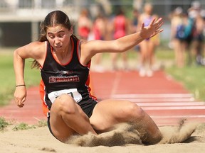 Kaiya Hlady of L'Essor competes in the senior girls' triple jump at the SWOSSAA track and field championship at the Chatham-Kent Community Athletic Complex in Chatham, Ont., on Wednesday, May 22, 2024. She had a winning jump of 11.01 metres. Mark Malone/Chatham Daily News/Postmedia Network