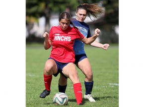 Ursuline Lancers' Addison Arnold, right, battles Holy Names Knights' Angelina Nawalany in the SWOSSAA senior girls soccer AAA final at Ursuline College Chatham in Chatham, Ont., on Wednesday, May 29, 2024. Mark Malone/Chatham Daily News/Postmedia Network