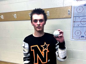 Owen Sound North Stars junior B captain Carter Moran poses with the ball he used to score his 100th-career OJBLL goal in a win on the road against the Wallaceburg Red Devils Sunday. Photo by the North Stars.