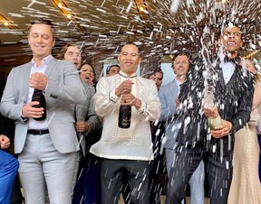 The Stratford Festival opened its 2024 season with a red-carpet gala that included the traditional champagne shower. From left: Eric Abel, Jason Sermonia and Devon Michael Brown take part. Photo taken on May 27, 2024. (Cory Smith/Stratford Beacon Herald)