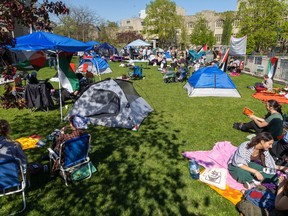 Pro-Palestinian protesters occupy the lawn outside the University Community Centre at Western University in London on Wednesday, May 1, 2024. (Derek Ruttan/The London Free Press)