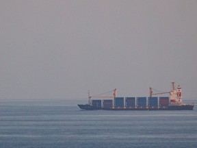 The container ship, Kota Rahmat - with the destination 'VSL NO LINK ISRAEL' - approaches the Bab-el-Mandeb strait on Jan. 18, 2024 in Obock, Djibouti.