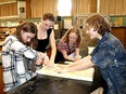 Jennica Grainger, 15, left Sadie Williams, 16, Sophia Andrews, 15, and Niamh Park, 15, of the Chatham-Kent secondary school environmental club, build one of many bat boxes for distribution by the Lower Thames Valley Conservation Authority. (Ellwood Shreve/Chatham Daily News)