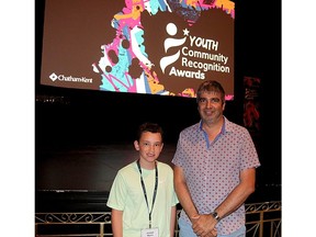 Joseph Myers, 10, a Grade 5 student at Good Shepherd Catholic in Thamesville, is seen here with his teacher Jason Pepper, at the first Youth Community Recognition Awards held Thursday at the Capitol Theatre in Chatham, to recognize the volunteer efforts of young people. PHOTO Ellwood Shreve/Chatham Daily News