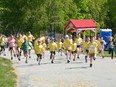 Participants take off at the start of the 1-kilometre family fun run during the Chesley Community Classic in support of the Brianne Gardhouse Memorial Youth Fund on May 27, 2023.