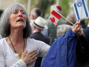 A tear falls down Floralove Katz's cheek as she sings Canada's national anthem at a city hall ceremony to mark Israel's Independence Day Tuesday.