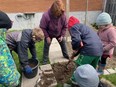 Leader Melody helps members experiment to see which potato planting will be the most successful during the April meeting of the Ripley and District Horticultural "For Our Youth" club. Supplied photo