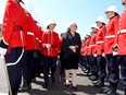 Governor General Mary Simon inspects an honour guard at the Royal Military College