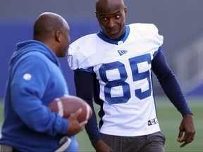 Milt Stegall jokes with defensive assistant Richie Hall during Winnipeg Blue Bombers rookie camp at Princess Auto Stadium on Wednesday.