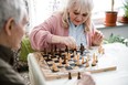 older adults playing chess