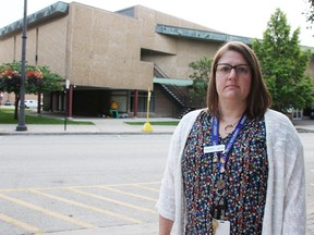 Upgrades to Sarnia's downtown library are being eyed, particularly for the covered patio and stairwell at the building's north. They're pictured in the background behind Lambton County Library assistant library supervisor Anna Lakey in September 2023. (Files)