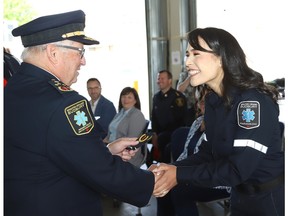 Joseph Nicholls, chief of Fire and Paramedic Services and general manager of Community Safety with the City of Greater Sudbury, welcomes new paramedic Sydney Taylor during a ceremony marking Paramedic Services Week at the Lionel E. Lalonde Centre in Azilda, Ont. on Tuesday May 21, 2024. John Lappa/Sudbury Star/Postmedia Network