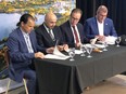 Larry Roque, chief of the Wahnapitae First Nation, left, Gimma (Chief) Craig Nootchtai of the Atikameksheng First Nation, second from left, Greater Sudbury Mayor Paul Lefebvre, second from right, and Kristan Straub, chief executive officer of Wyloo Canada, sign a memorandum of understanding Wednesday to secure land for the construction of Wyloo Canada's proposed downstream battery materials processing facility in the city. The processing facility is expected to open in 2030 and process ore from Wyloo Canada's Eagle's Nest nickel project in the Ring of Fire area of northwestern Ontario. Harold Carmichael/Sudbury Star/Postmedia Network