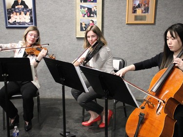 Angela Garwood-Touw, from left, Joanna Millson and Yu Pei with the Timmins Symphony Orchestra