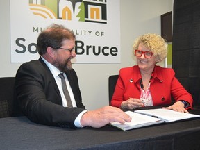 South Bruce Mayor Mark Goetz and Nuclear Waste Management Organization president and CEO Laurie Swami sign a $418 million hosting agreement on Wednesday, May 1, 2024.