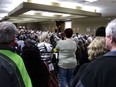 It's standing room only at the Save the Durham Hospital rally inside the Durham Community Centre hall on Tuesday, May 7, 2024, as Save the Durham Hospital committee chair Jana White readies to begin the evening of speakers on stage.