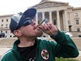 Cannabis Business Association of Manitoba chair Steven Stairs sparks up a joint on the front lawn of the Manitoba Legislative Building grounds during a protest against the way the NDP handled legislation which repealed a provincial ban of homegrown cannabis, on Monday, May 6, 2024.