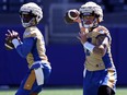 Chris Streveler (right) and Terry Wilson throw during Winnipeg Blue Bombers rookie camp at Princess Auto Stadium on Wednesday, May 8, 2024.