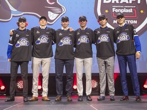 Six of the Saint John Sea Dogs draft picks pose for a photo after the 2024 QMJHL draft was completed Saturday at the Avenir Centre in Moncton.