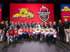 Members of the Moncton Wildcats organization pose for a photo with their 2024 QMJHL draft class Saturday at the Avenir Centre.
