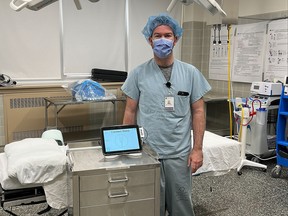 General surgeon Dr. John Stirrat with a MOLLI tablet, part of a system recently introduced at the SBGHC Kincardine hospital for breast cancer surgery. (SBGHC)