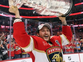 Brandon Montour of the Florida Panthers carries the Stanley Cup after Florida's 2-1 victory against the Edmonton Oilers in Game 7 of the 2024 Stanley Cup Final at Amerant Bank Arena on June 24 in Sunrise, Florida. Montour, from Ohsweken, is a former player with the Brantford Golden Eagles in the Greater Ontario Junior Hockey League. (Photo by Bruce Bennett/Getty Images)