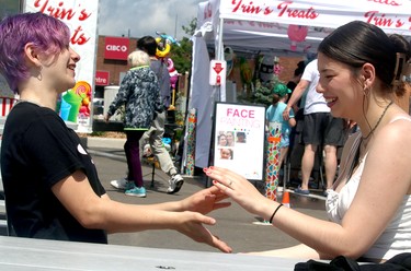 Sisters Chui Mun Brooke Line and Jade Line at Poutine Feast at Downtown Plaza in Sault Ste. Marie, Ont., on Saturday, June 29, 2024. (BRIAN KELLY/THE SAULT STAR/POSTMEDIA NETWORK)