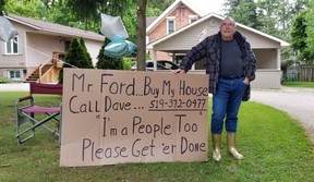 Dave Low, one of the new wellness centre’s neighbours, with a sign asking the premier to buy his house on Friday, June 7, 2024 in Owen Sound, Ont. (Scott Dunn/The Sun Times/Postmedia Network)