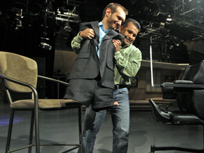 Nick Vujicic is helped by his assistant Richie Pacheco during his appearance on 100 Huntley Street at the Crossroads Centre in Burlington November 10th 2010. Nick was born with no arms, and no legs, and he's been traveling the world spreading the word of God. Photo by Dave Abel/file photo