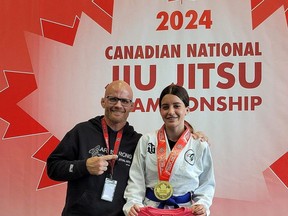 Isabelle Armstrong, right, of Chatham’s Armstrong Academy of Martial Arts celebrates with instructor Thomas Armstrong after winning a gold medal at the Canadian Jiu-Jitsu Association national championships in Brampton, Ont., on Sunday, June 9, 2024. She has qualified to represent Canada at the 2024 Ju-Jitsu International Federation world championships in Heraklion, Greece. (Submitted Photo)