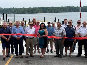The newly redesigned Ivy Lea Wharf was officially brought on-line with a formal ribbon cutting on June 19 at 4 p.m. L-r, front: Leeds-Grenville-Thousand Islands and Rideau Lakes Steve Clark M.P.P., Councillor Brian Maybee, Councillor Mark Jamison, Mayor Corinna Smith-Gatcke, Councillor Terry Fode middle: CAO Stephen Donachey, Ken Kehoe (Kehoe Marine Construction), Councillor Brock Gorrell, Jamie Cote (TIA), Councillor Jeff Lackie, District Chief C Richardson back: Kevin Hawley (Greer Galloway), Donna Cote (TIA), Captain P. Dickson, and Director Operations David Holliday Supplied by Township of Leeds and the Thousand Islands