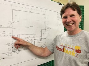 Partners in Mission Foodbank executive director Dan Irwin points to the new shopping area, which will allow its clients to choose the foods they want rather than receive a prepacked hamper, that will be in its new building that was purchased in April. Partners in Mission Foodbank hopes to move into the new facility, which is twice the size as its current one, early next year.