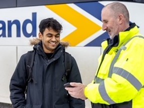 Ontario Northland motorcoach operator Jeffrey Schoenberger welcomes passenger Karan Sharma onboard. The bus is a safe and reliable way to get around Ontario. WiFi and wide windows make the journey a convenient and pleasant way to pass the time along the extensive network. Ontario Northland photo