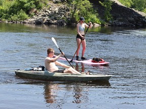 osh Gravelle and Autumn Ongarato go for a paddle on Vermillion River at McCharles Lake in Whitefish, Ont. on Monday June 17, 2024. John Lappa/Sudbury Star/Postmedia Network