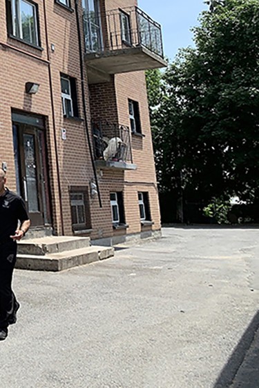 Police officers leave a building on Russell Street in Kingston, Ont. on Wednesday, June 5, 2024.
