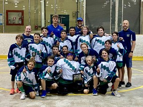 Sudbury Rockhounds U13 players and staff celebrate their championship at the Nickel City Shootout.