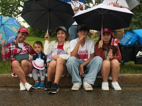 Fort Sask residents brave the rain to catch the 2024 Canada Day parade.