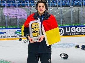 Max Bleicher poses with the trophy after the Germany under-18 team won the World Junior Championships Under-18 Division 1A gold medal earlier this year. Photo credit EV Füssen/X