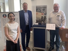Christina Han, president of the Canadian Industrial Heritage Centre (CHIC), Mayor Kevin Davis and Rob Adlam, a director with the CHIC, at the recent unveiling of a new exhibit commemorating the 180th anniversary of Brantford's first industry. VINCENT BALL/Brantford Expositor