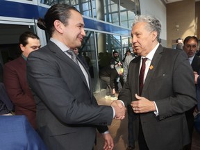 Manitoba Premier Wab Kinew shakes hands with federal Northern Affairs Minister Dan Vandal, MP for St. Boniface - St. Vital at an event at Portage Place, in Winnipeg, where development plans were announced on Friday, April 5, 2024.