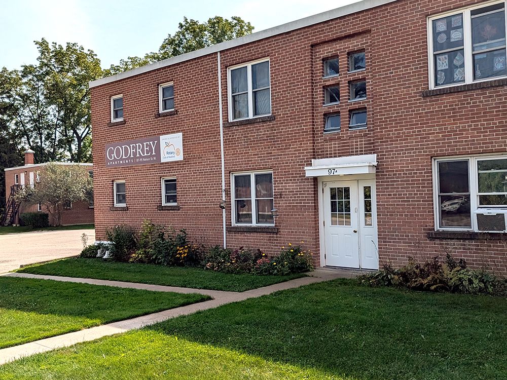 Rotary Club examines redevelopment of aging Godfrey Apartments in