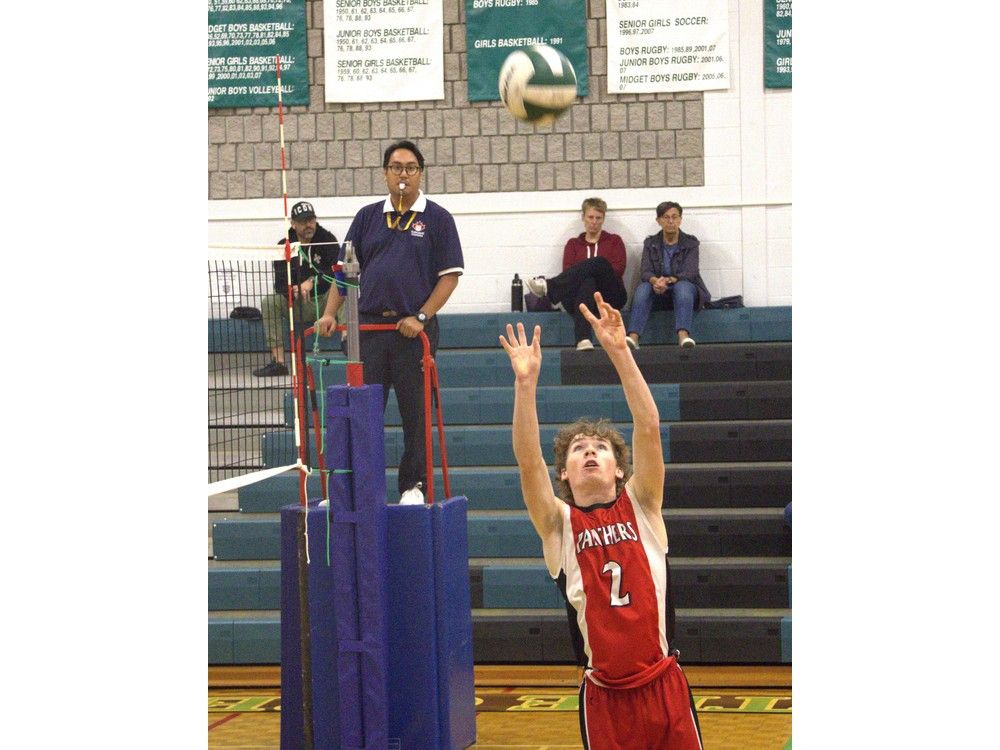 Max Kolesar of Paris District High School sets the ball against St. John's College during AABHN senior boys volleyball semifinal action on Monday at SJC. Brian Smiley