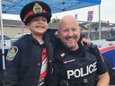 A Cornwall youth posing with Cornwall Police Service Const. Casey MacGregor.