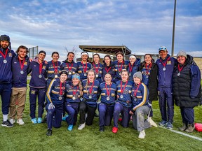Laurentian University flag football players and coaches pose with their silver medals from the 2025 Football Ontario Intercollegiate Women's Flag Football Championship in Peterborough.