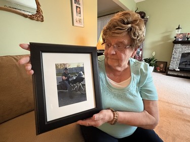 A women holding up a picture frame